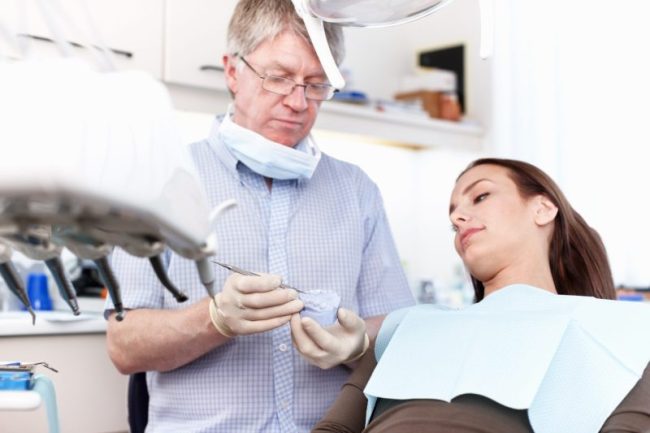 Man,,Dentist,And,Woman,With,Mould,At,Clinic,For,Cleaning preventative dentist taylorsville