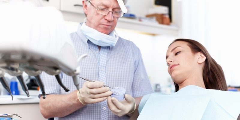 Man,,Dentist,And,Woman,With,Mould,At,Clinic,For,Cleaning preventative dentist taylorsville