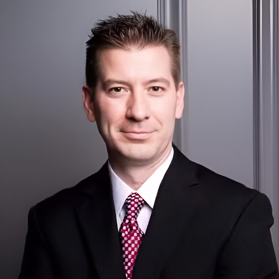 Dr. Joshua Frandsen, the dentist at Horizon Dental, in a dark suit and tie
